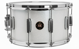 Snare drum with a white glittery finish and chrome hardware on a white background