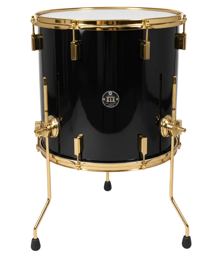 Black drum with gold hardware on a white background