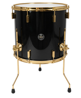Black drum with gold hardware on a white background