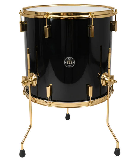 Black drum with gold hardware on a white background