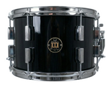 Black snare drum with chrome hardware on a white background