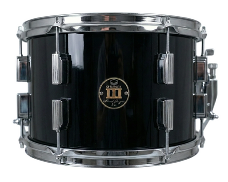 Black snare drum with chrome hardware on a white background