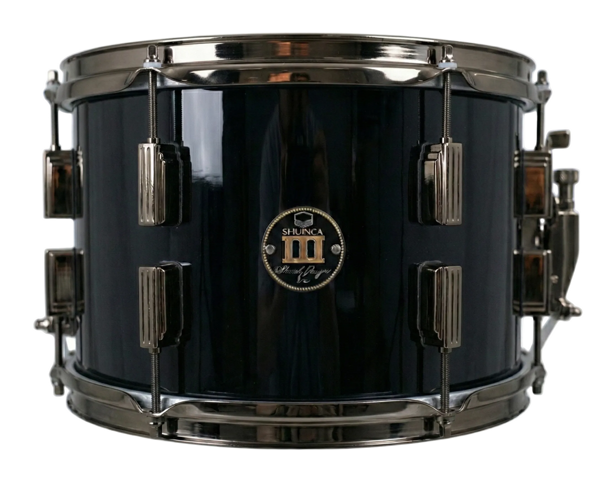 Black snare drum with chrome hardware on a white background